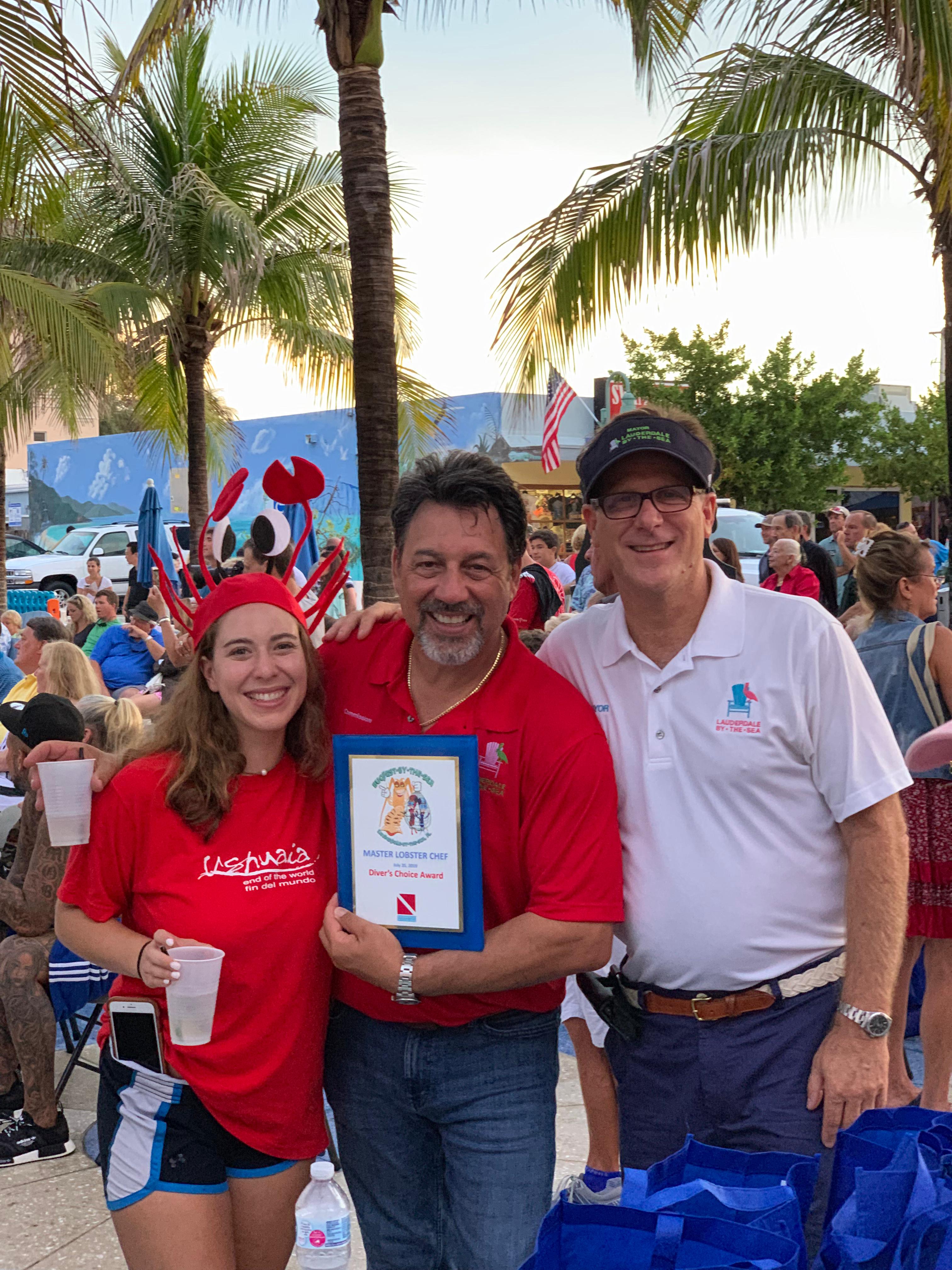 Randy Strauss at Lobsterfest holding a local award
