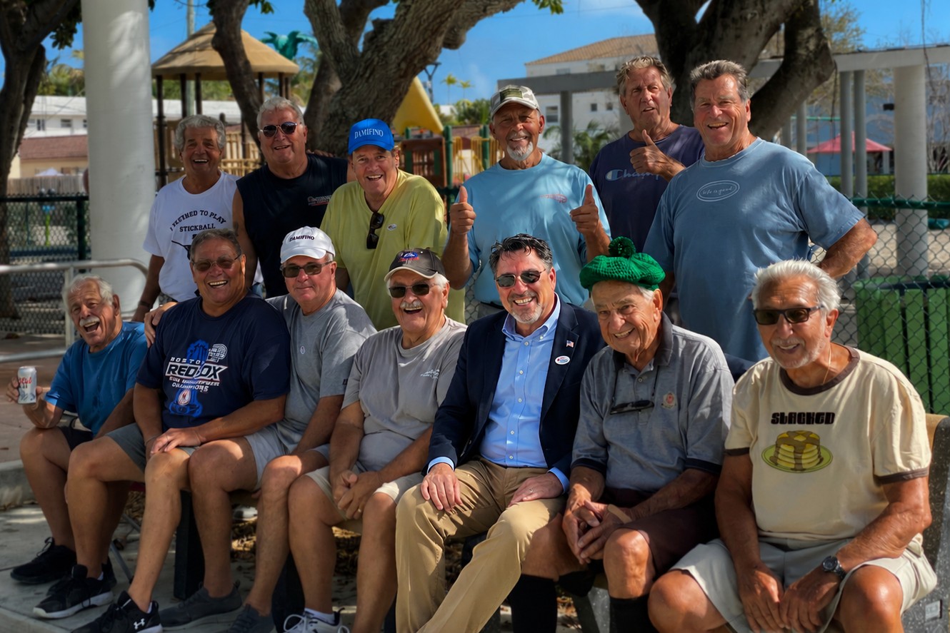 Randy Strauss standing with community members